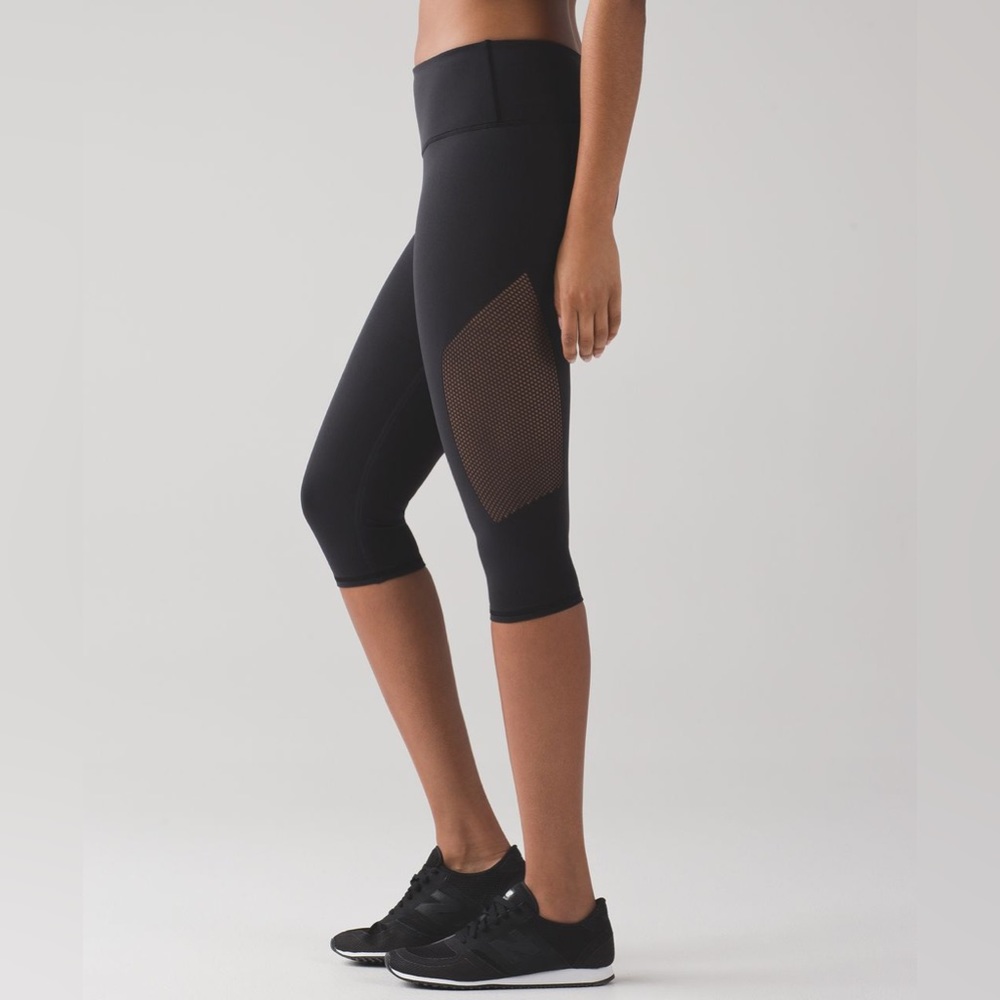 Lululemon Reveal Crop in Black. 
Size 2. 
Pristine Condition.